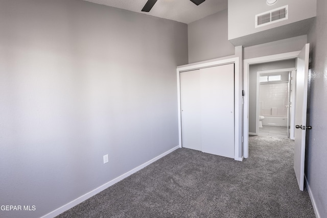 unfurnished bedroom featuring ceiling fan, carpet floors, and a closet