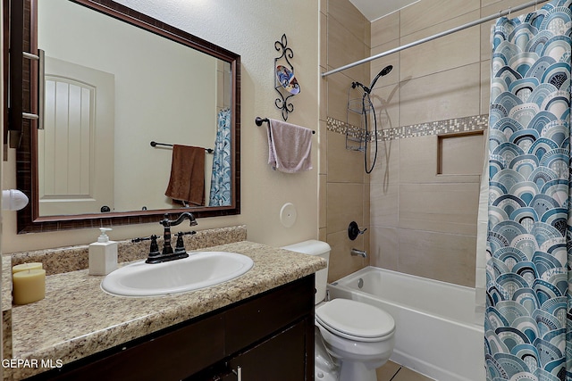 full bathroom featuring shower / tub combo with curtain, vanity, and toilet