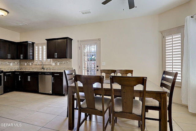 dining room featuring light tile patterned floors and ceiling fan