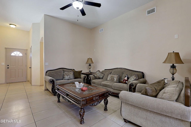 tiled living room with ceiling fan