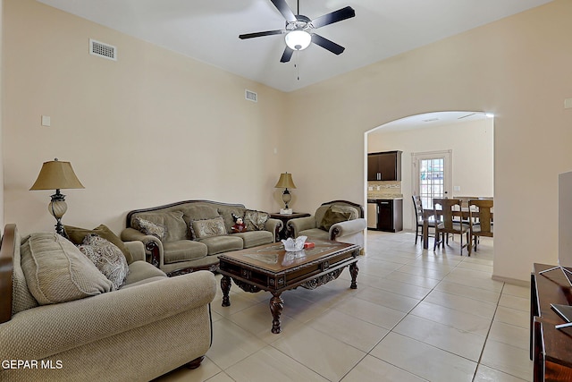 living room with light tile patterned floors and ceiling fan