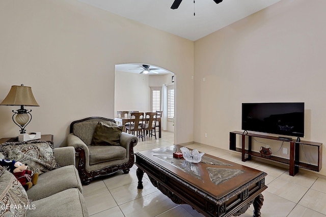 living room featuring light tile patterned floors and ceiling fan