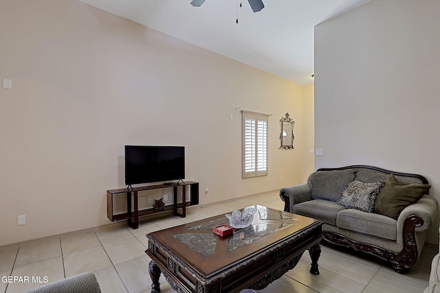 tiled living room with ceiling fan