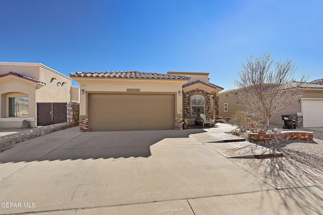 mediterranean / spanish house featuring a garage