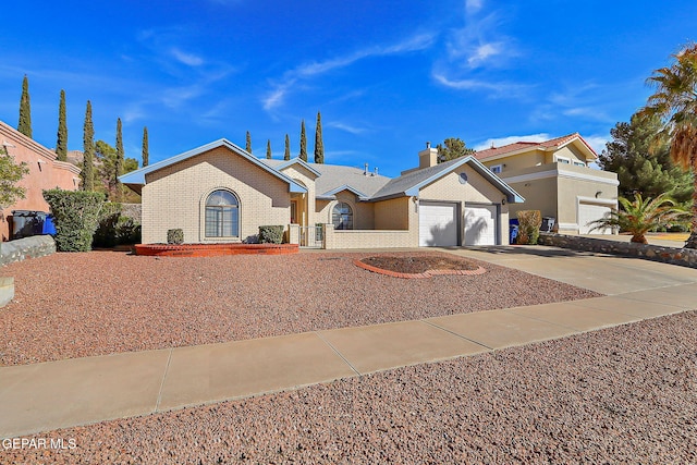 single story home featuring a garage