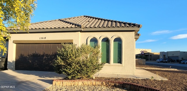 view of property exterior featuring a garage