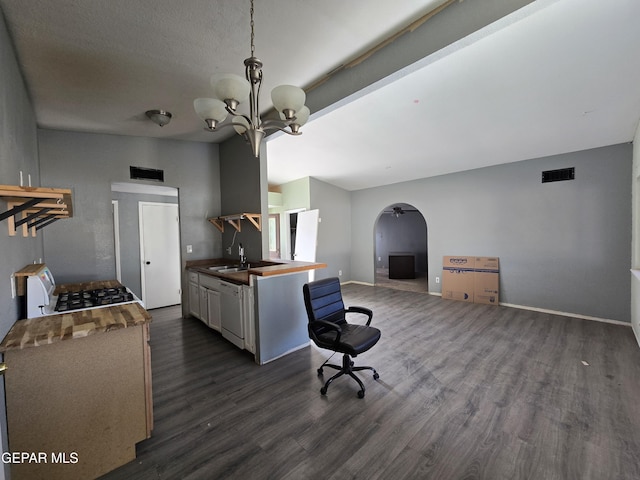 kitchen with lofted ceiling, sink, a chandelier, white dishwasher, and dark hardwood / wood-style flooring