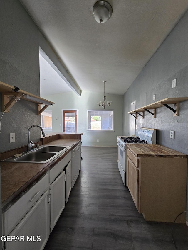 kitchen featuring sink, butcher block countertops, lofted ceiling with beams, white appliances, and white cabinets