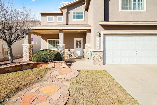 view of front of property featuring a garage and covered porch