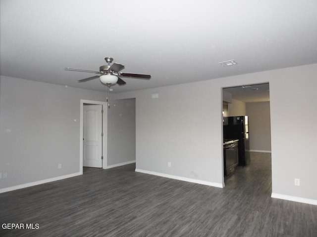 unfurnished room with dark hardwood / wood-style floors and ceiling fan