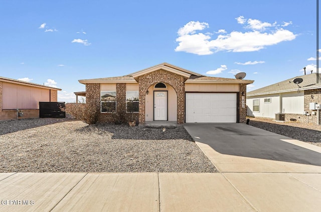 ranch-style home featuring a garage