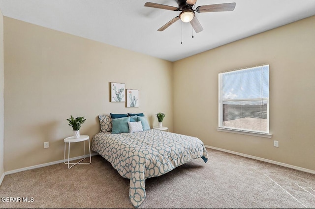 bedroom featuring ceiling fan and carpet