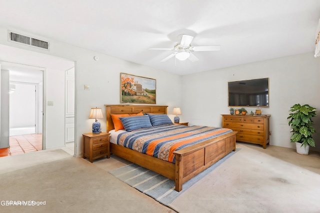 bedroom with light carpet and ceiling fan