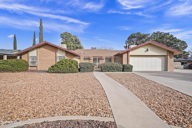 ranch-style home featuring a garage