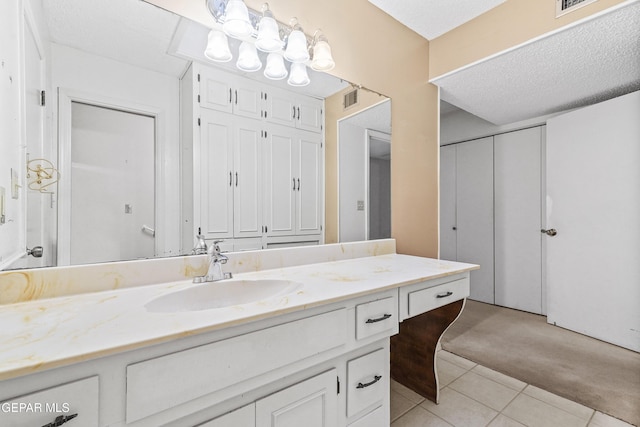 bathroom with vanity and tile patterned flooring