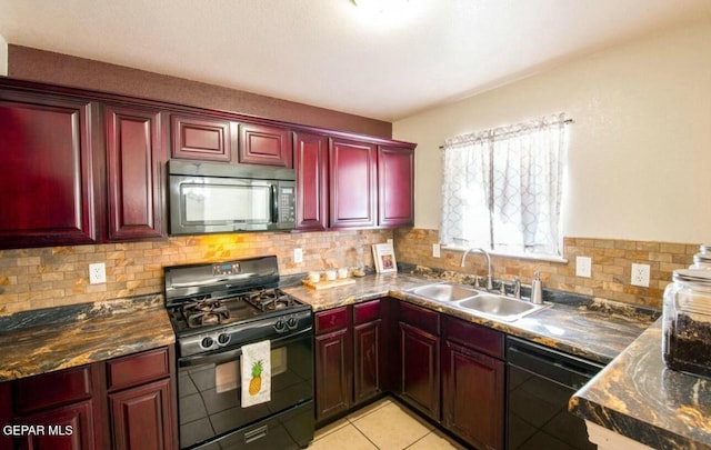 kitchen featuring light tile patterned floors, sink, decorative backsplash, and black appliances