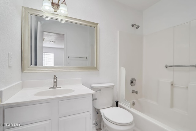 bathroom featuring vanity, toilet, and shower / bathtub combination