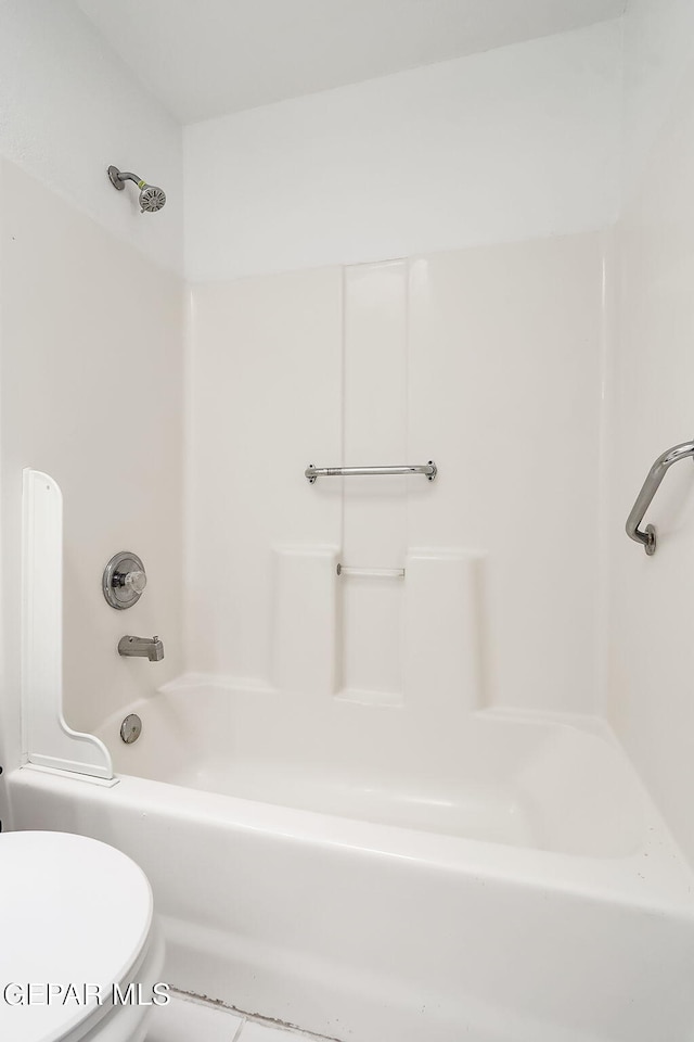 full bathroom featuring toilet and shower / tub combination