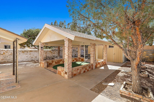 view of patio with fence and a gazebo