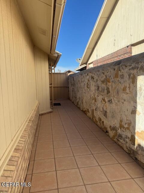 view of side of home with fence