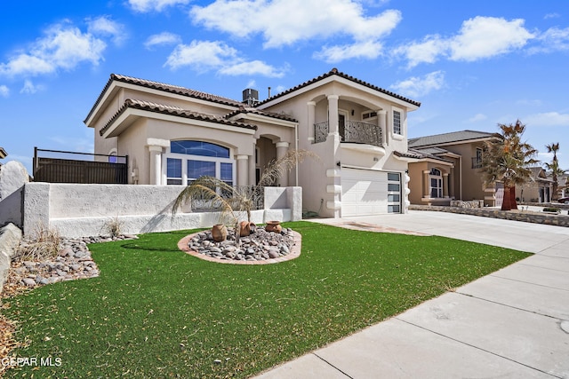 mediterranean / spanish-style house with a garage, a front lawn, and a balcony