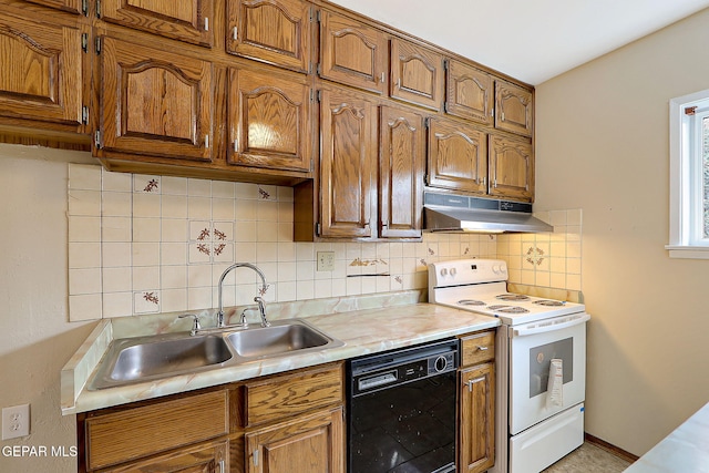 kitchen with tasteful backsplash, sink, electric range, and black dishwasher