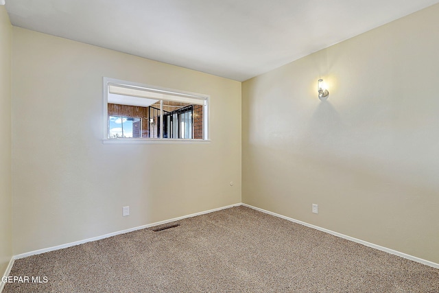 empty room with carpet flooring