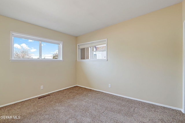 spare room featuring carpet