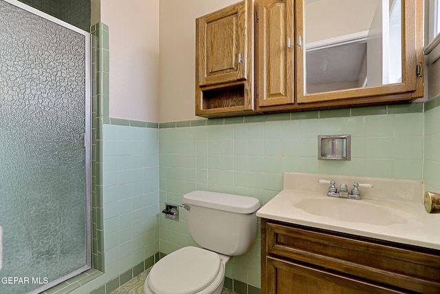 bathroom featuring vanity, tile walls, an enclosed shower, and toilet