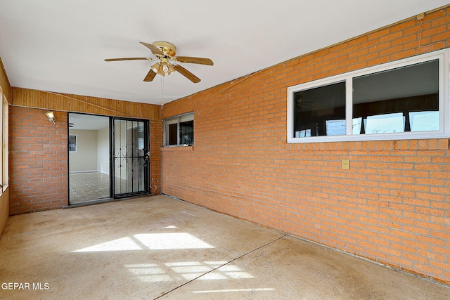 exterior space featuring ceiling fan