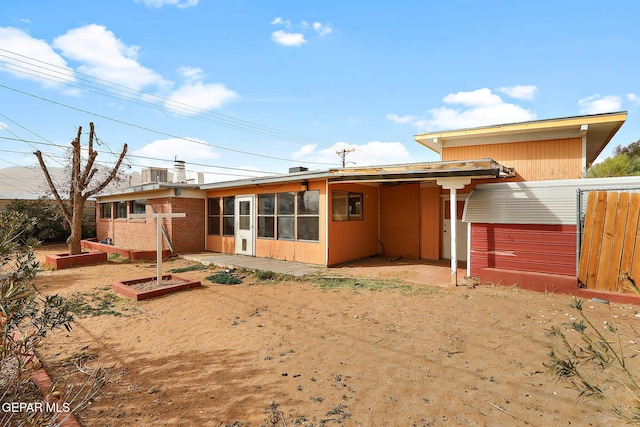 back of house with cooling unit and a patio