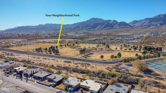 birds eye view of property with a mountain view