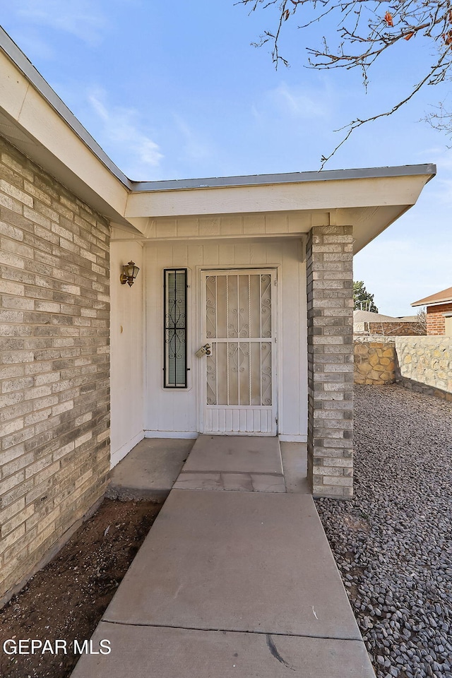 property entrance featuring a patio