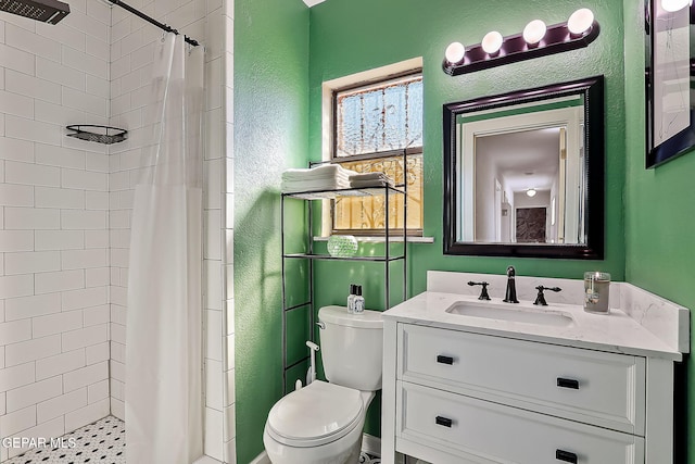 bathroom featuring vanity, toilet, and a shower with curtain