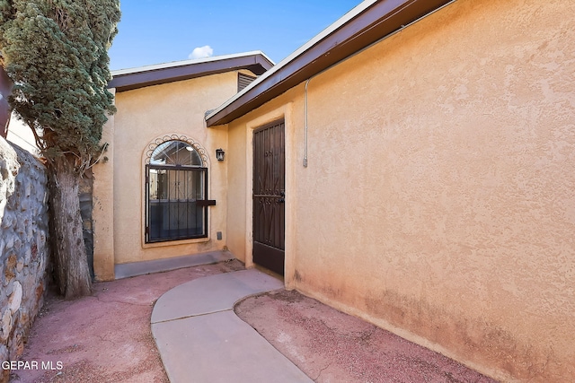 doorway to property with a patio