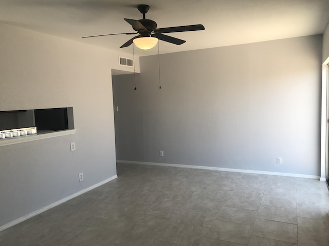 unfurnished room featuring ceiling fan