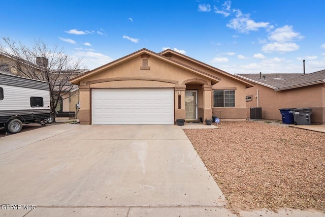 single story home with a garage and cooling unit