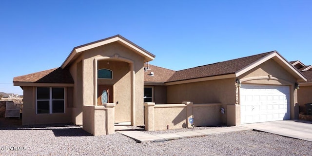 single story home featuring a garage