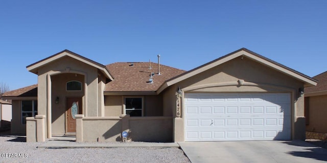 single story home featuring a garage