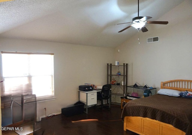 bedroom featuring ceiling fan, dark hardwood / wood-style flooring, and vaulted ceiling