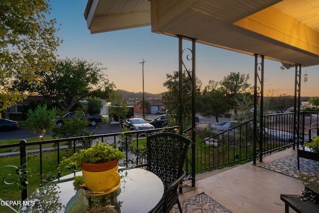 view of balcony at dusk