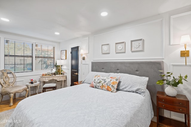 bedroom featuring hardwood / wood-style flooring