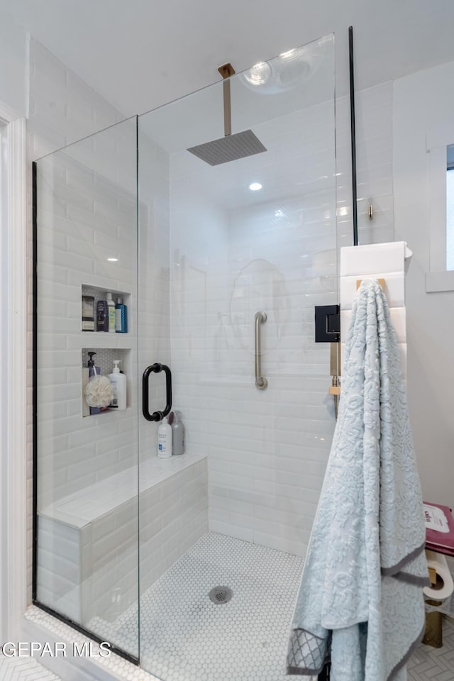 bathroom featuring an enclosed shower