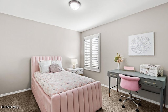 bedroom with dark colored carpet