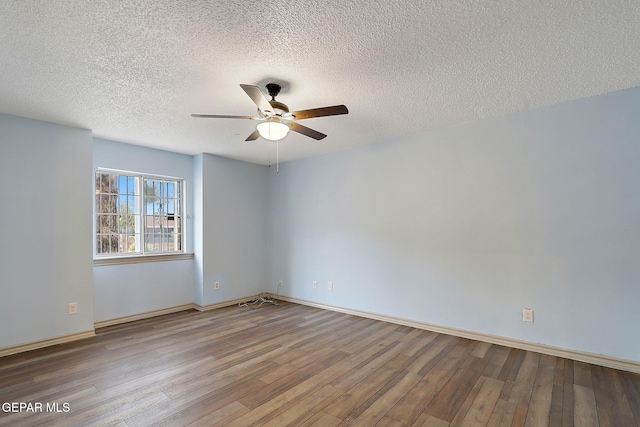 spare room with hardwood / wood-style flooring, a textured ceiling, and ceiling fan