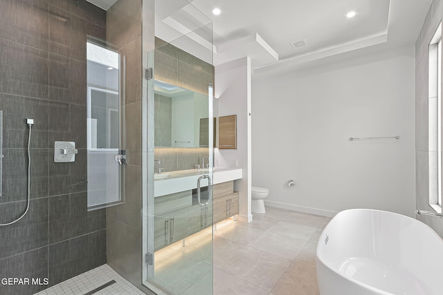 full bathroom featuring vanity, toilet, separate shower and tub, and tile patterned flooring