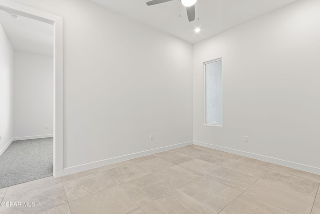 tiled empty room with ceiling fan