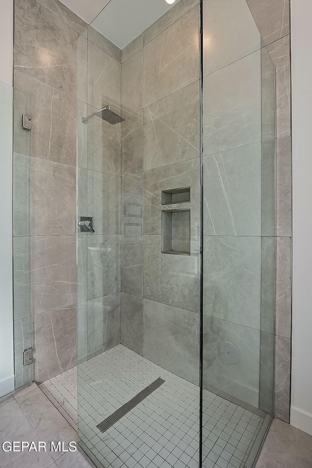 bathroom with a shower with shower door