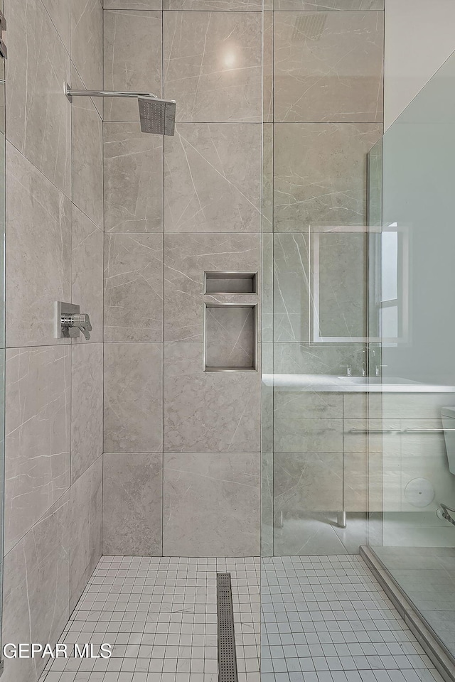 bathroom featuring walk in shower