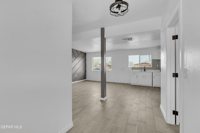 interior space with sink and light hardwood / wood-style flooring